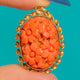 9ct Gold Coral pendant, front view of the carved flowers and undulating Gold border