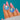Silver and blue Enamel shell earrings held together to show the pair