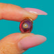 Deep-red oval Garnet with a central Pearl and Gold jump ring
